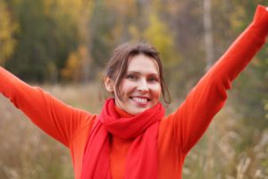 girl in red smiling