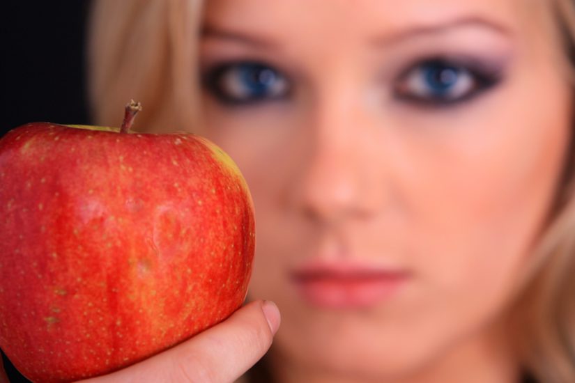 girl holding an apple